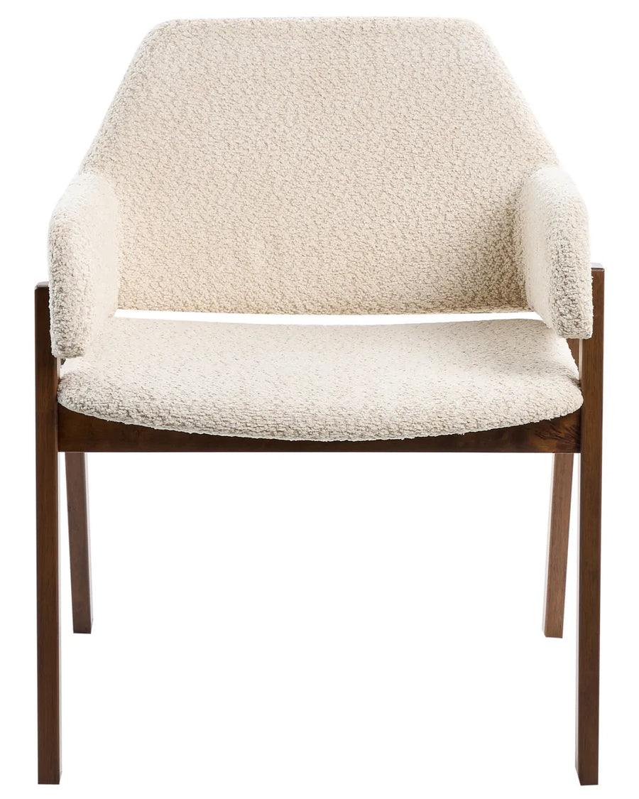 Cream bouclé armchair with a curved back, integrated armrests, and a walnut-finish wooden frame.