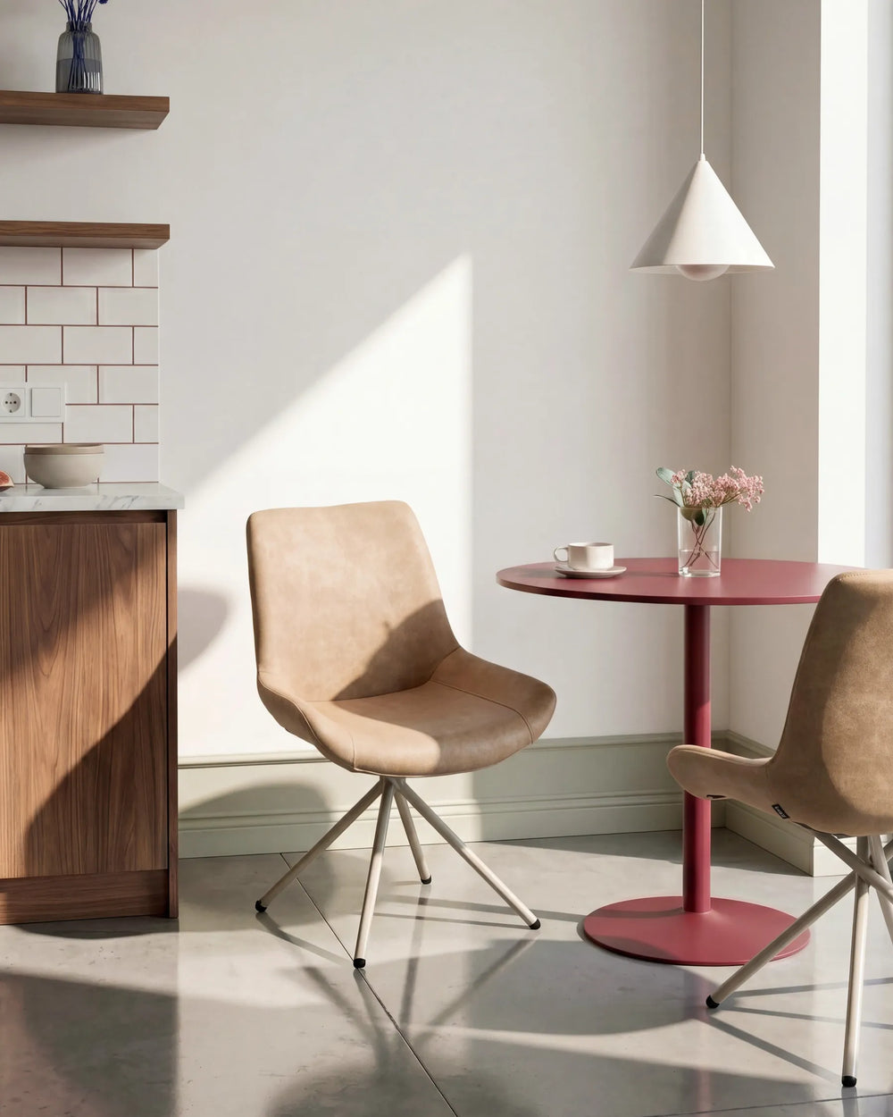 Tan dining chairs styled in a bright contemporary space, adding warm tones and modern comfort to a casual dining area.