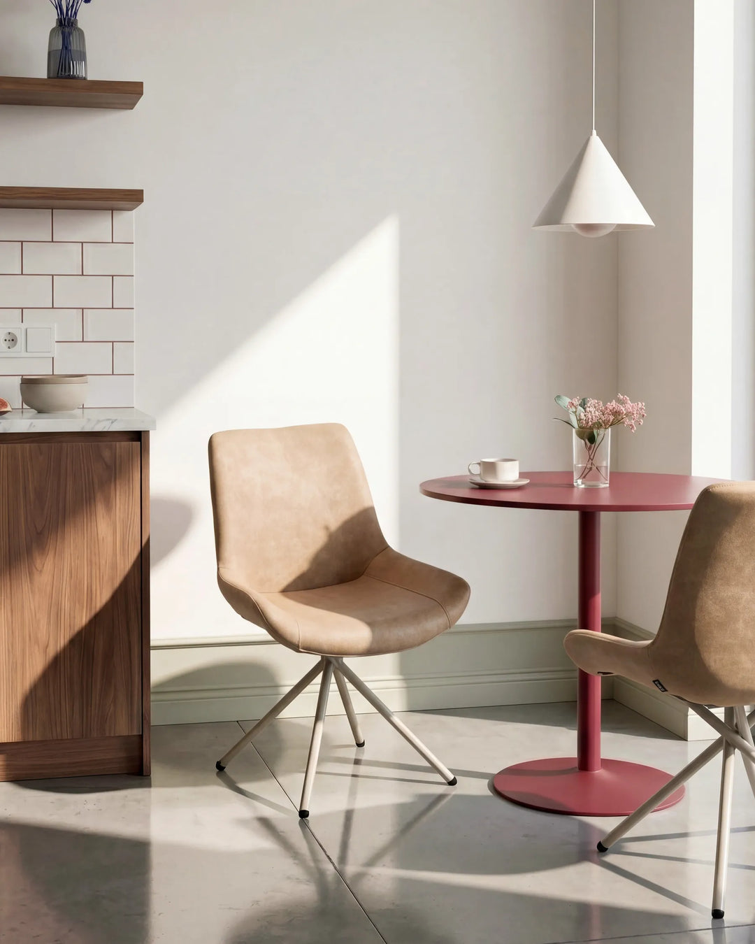 Tan dining chairs styled in a bright contemporary space, adding warm tones and modern comfort to a casual dining area.