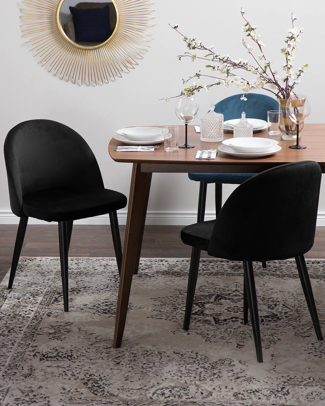 Elegant black dining chairs styled around a wooden dining table, adding a sophisticated modern touch to the dining room.
