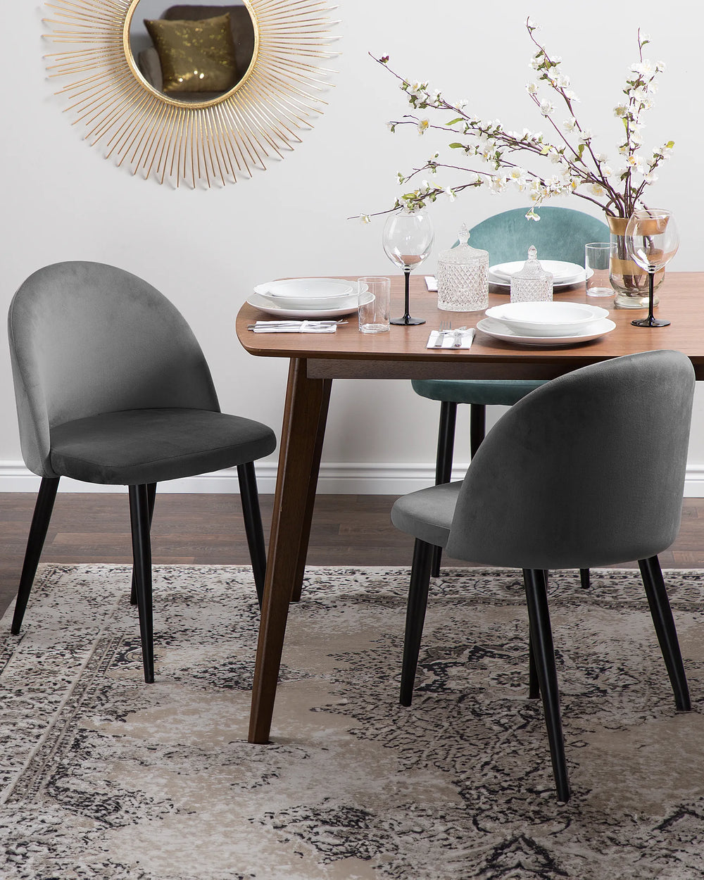 Modern grey dining chairs styled around a wooden dining table, creating a refined and inviting dining space.