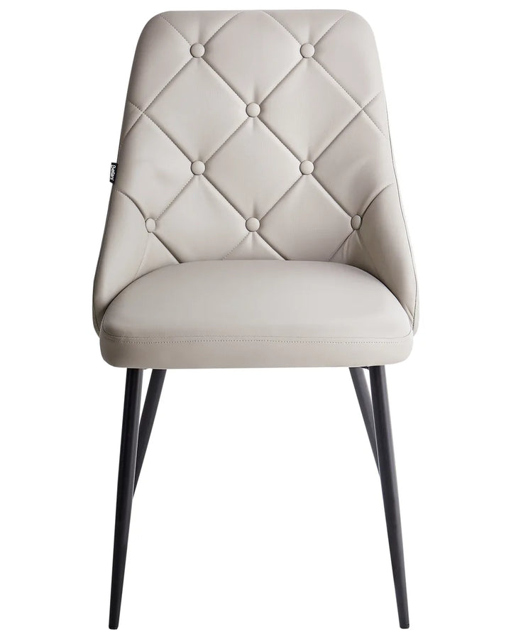 Light beige faux leather dining chair with elegant diamond-tufted button detailing, a padded seat, and sleek black metal legs for a sophisticated contemporary look.