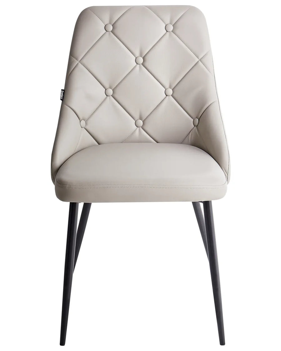 Light beige faux leather dining chair with elegant diamond-tufted button detailing, a padded seat, and sleek black metal legs for a sophisticated contemporary look.