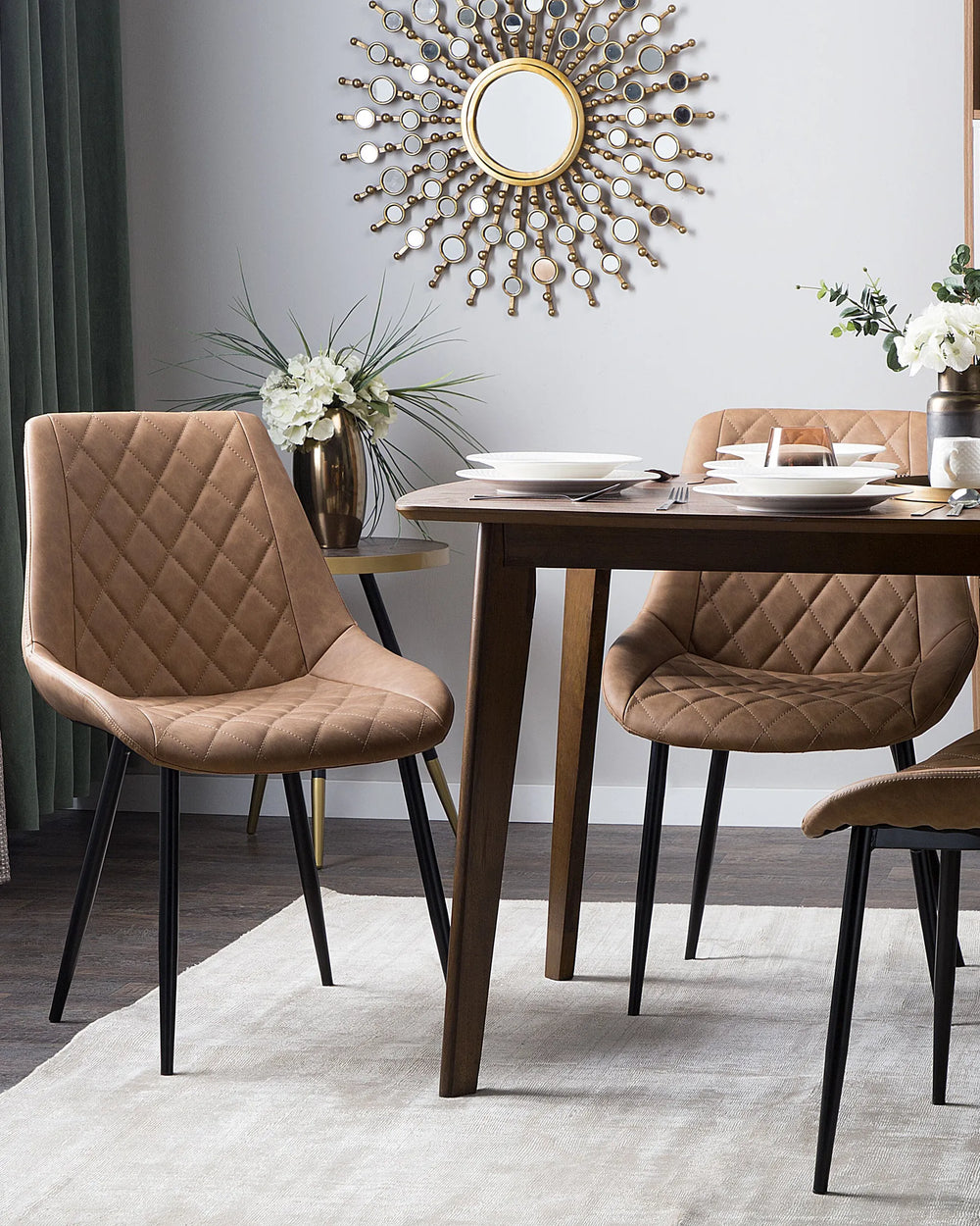 Stylish dining setting showcasing quilted brown dining chairs paired with a dark wood table, creating a warm, sophisticated atmosphere with a subtle industrial-modern touch.