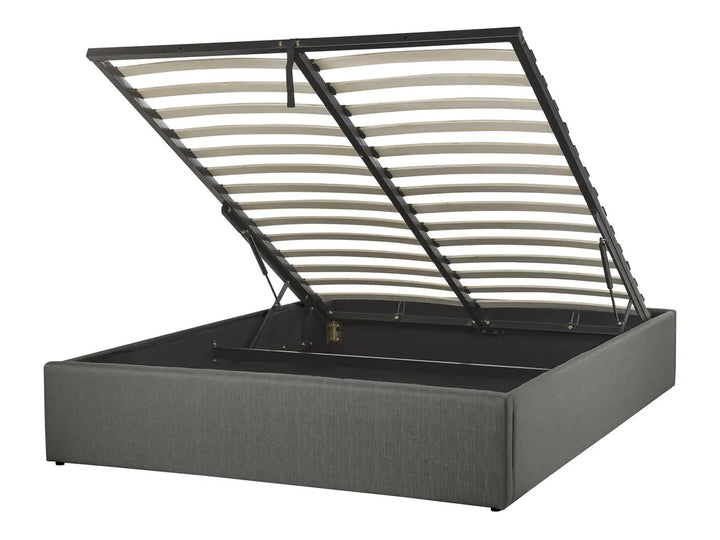 Gray upholstered bed frame with metal headboard on a white background