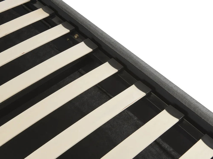 Close-up of a black and beige striped fabric with a metal frame.