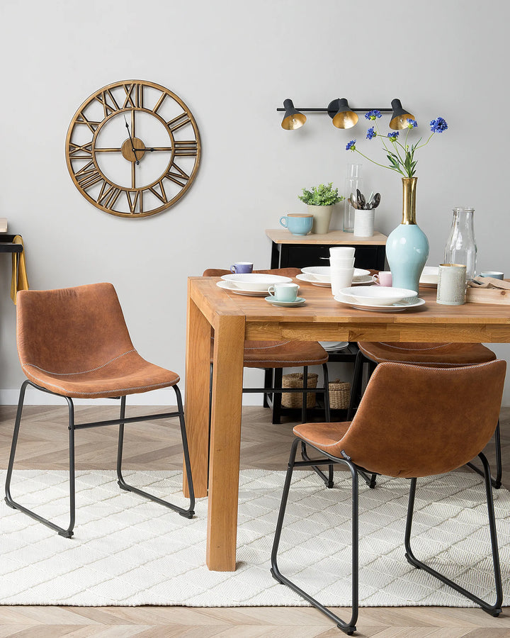 Contemporary dining space featuring warm brown dining chairs paired with natural wood furniture, adding character and casual elegance to everyday meals.