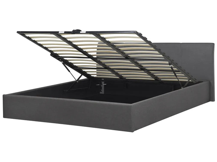 Grey upholstered bed frame with an open storage compartment 