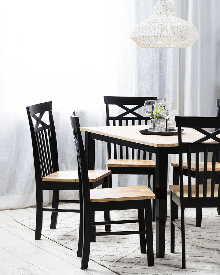 Paired with a matching dining set, these chairs bring warmth and contrast to classic, rustic, and country-inspired dining spaces.