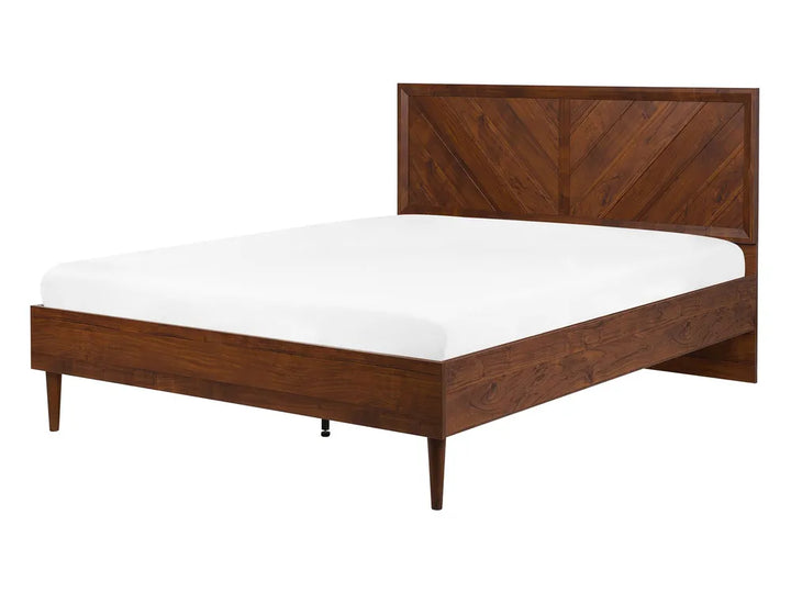 Dark wooden bed frame with headboard and white mattress on a white background