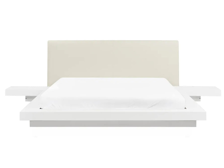 White bed with a beige headboard 