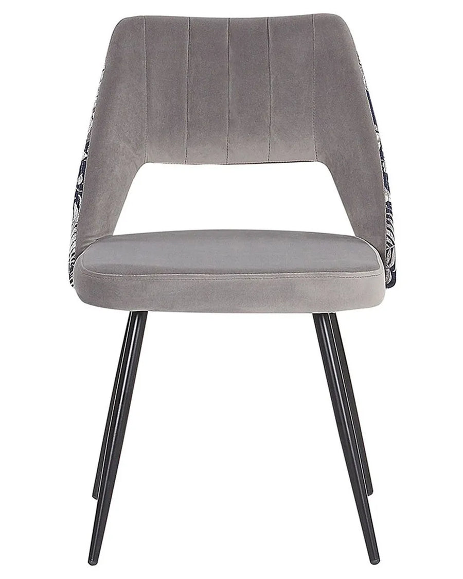 Grey upholstered dining chair with an open back, floral-patterned sides, and black metal legs.