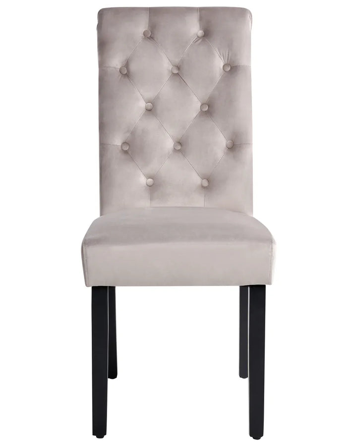 Light grey velvet dining chair with a button-tufted high back, plush padded seat, and sturdy black wooden legs.