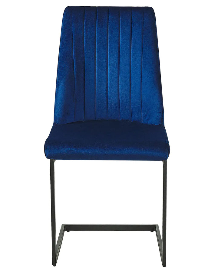 Blue velvet dining chair with vertical stitching and a sleek black cantilever frame.