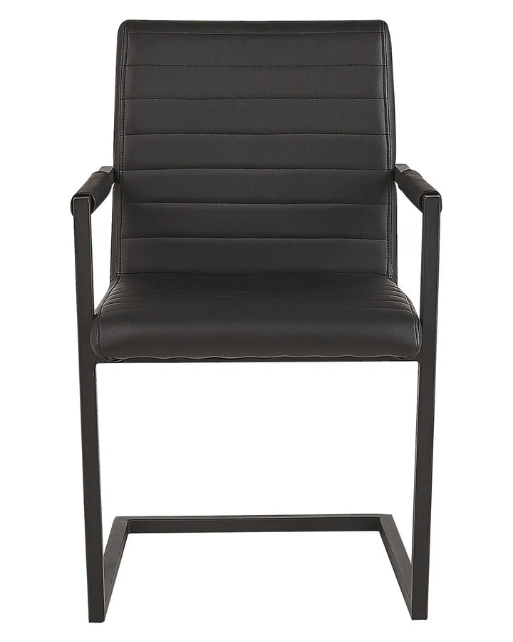 Modern cantilever dining chair upholstered in sleek black faux leather, featuring horizontal stitched detailing, integrated armrests, and a sturdy black metal frame for a contemporary look and supportive comfort.