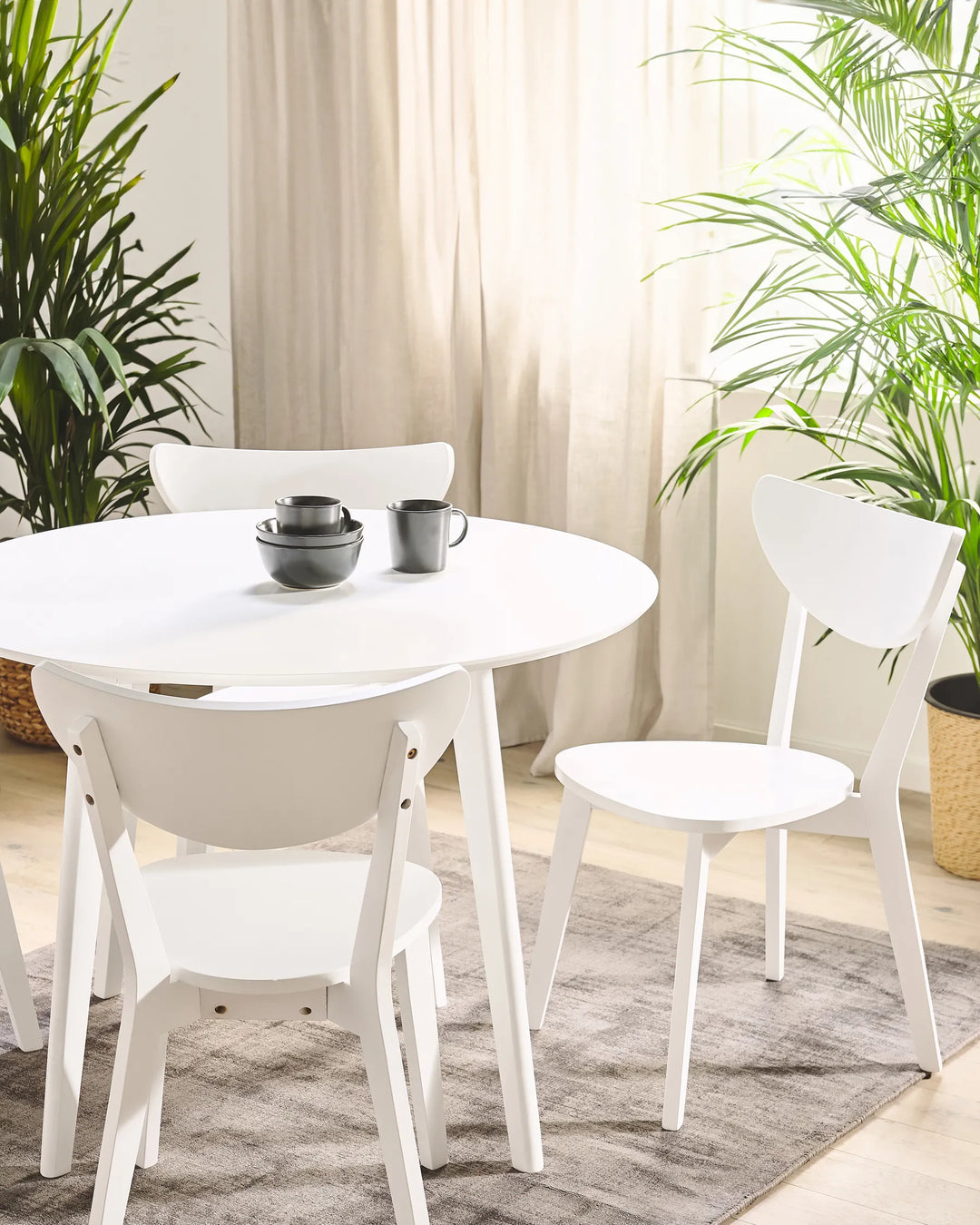Paired with a round dining table, the chairs create a bright and airy dining space, perfect for modern, minimalist, or Nordic interiors.