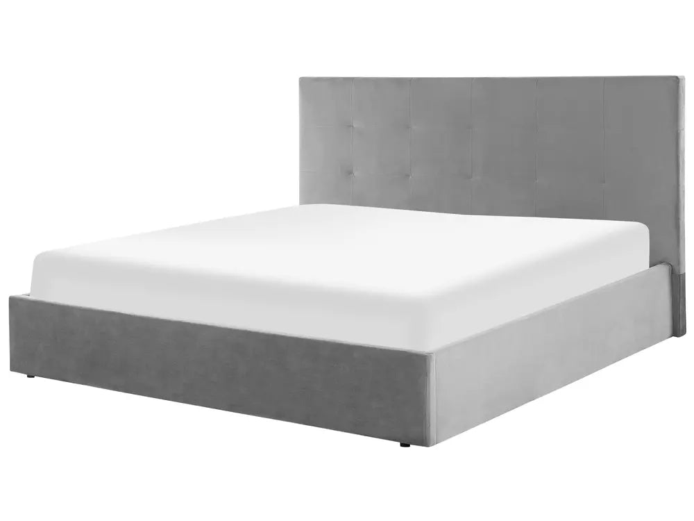 Grey upholstered bed with white mattress 