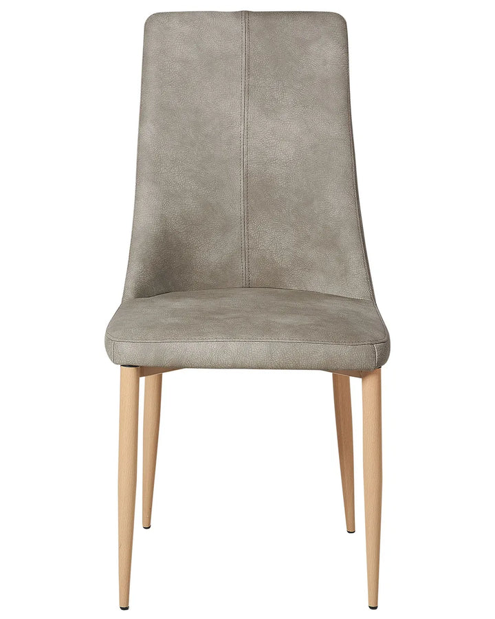 Elegant dining chair upholstered in light grey faux leather with a subtly distressed finish, featuring a high supportive backrest and tapered natural wood-effect legs. Its clean silhouette and soft padding offer both comfort and contemporary style.
