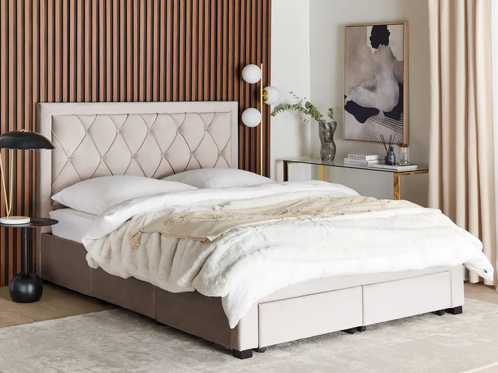 Beige upholstered bed in a stylish bedroom 