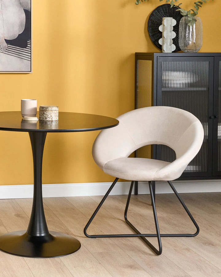 Off -white dining chairs with backrests and meta legs arranged around a dining table.