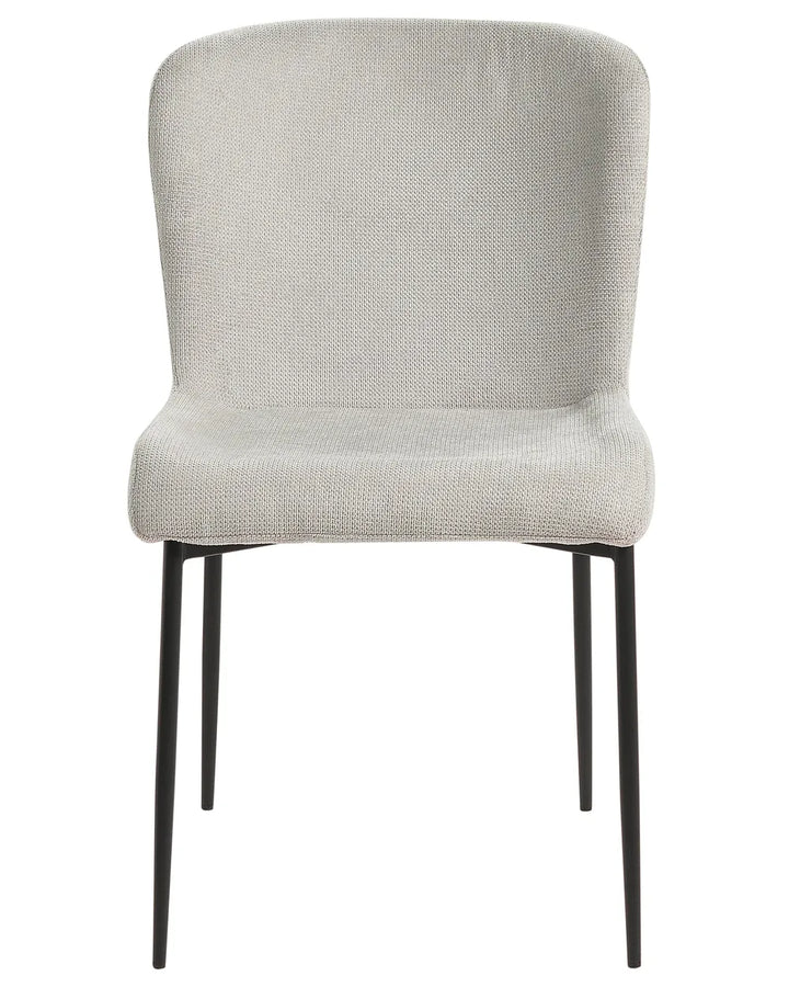 Light grey upholstered dining chair featuring a curved backrest, cushioned seat, and slim black metal legs. Its clean silhouette and textured fabric create a contemporary, minimalist look suitable for dining spaces and modern interiors.