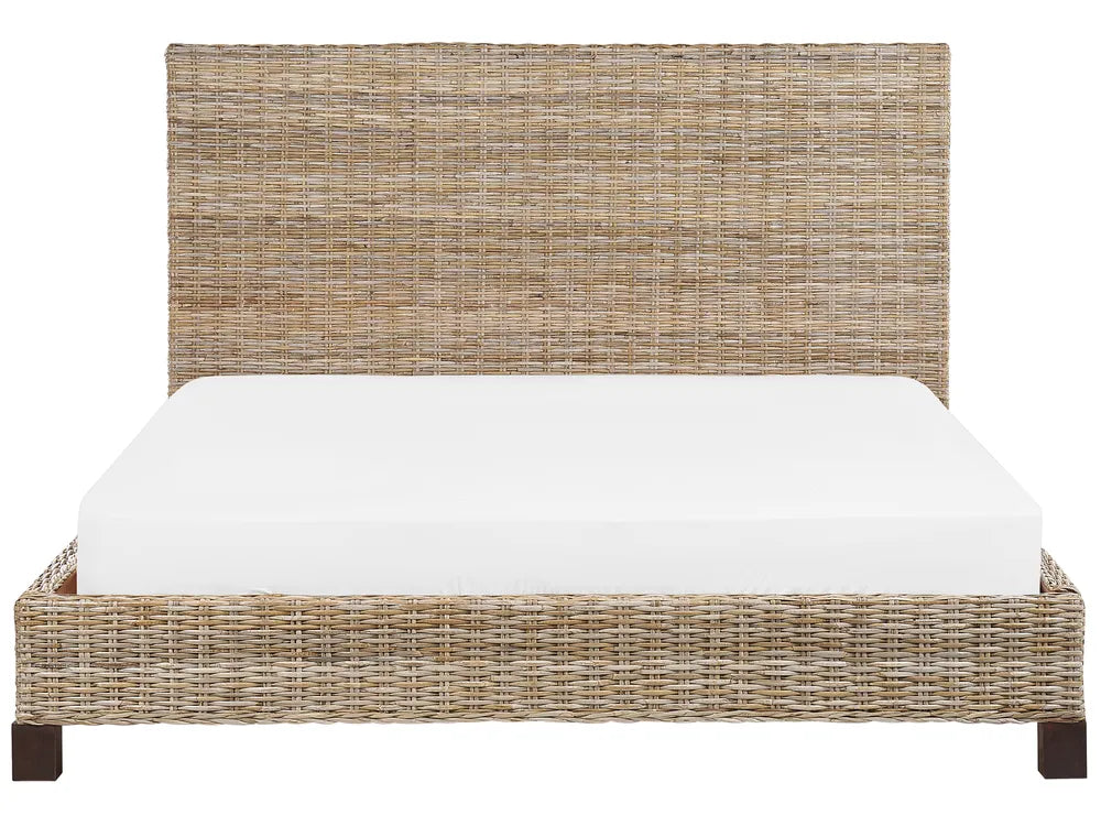 Wicker bed with white mattress on a white background
