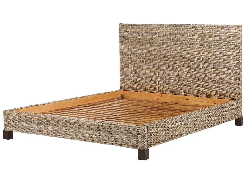 Wicker bed frame with wooden slats on a white background