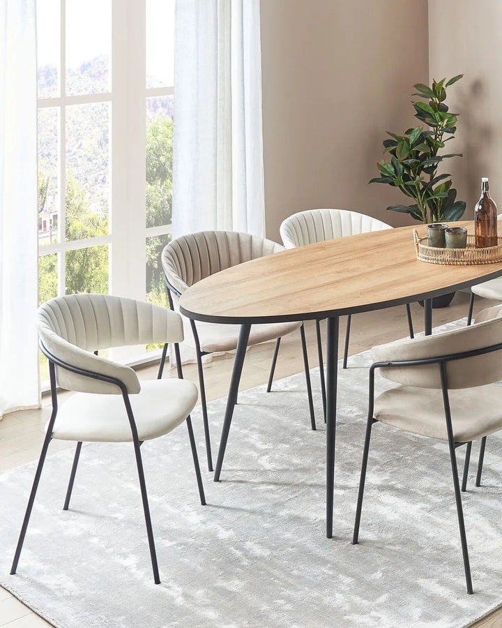 Cream dining chairs styled around a wooden dining table in a bright, modern dining room.