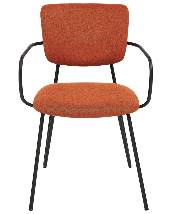 Rust orange upholstered dining chair with black metal frame and integrated armrests.
