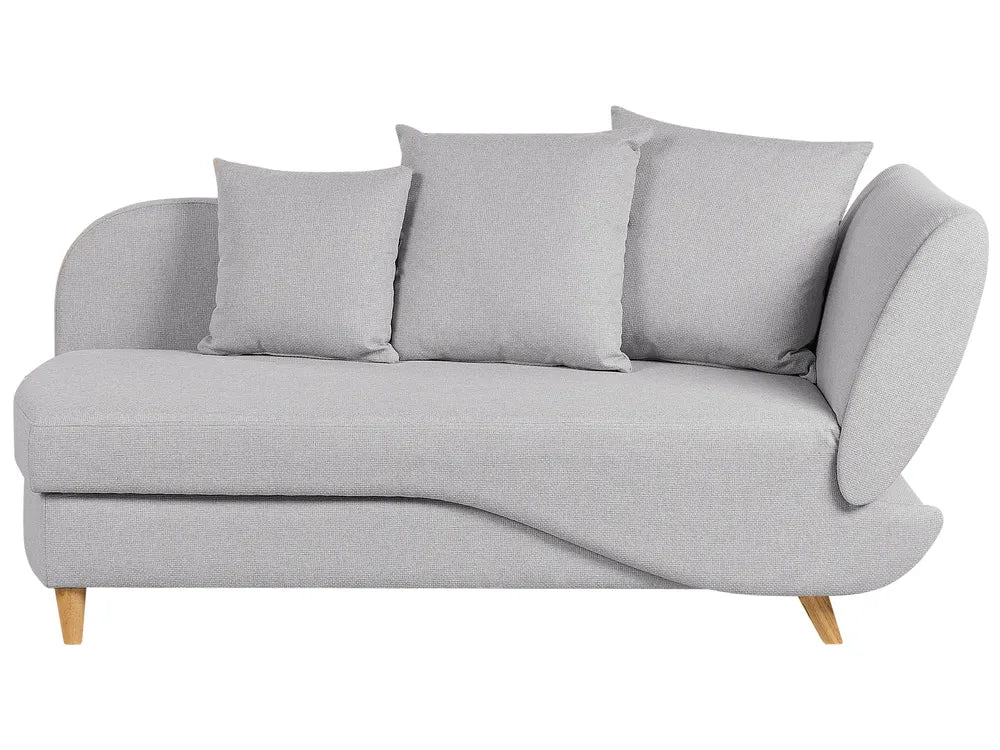 Gray sofa with three cushions on a white background