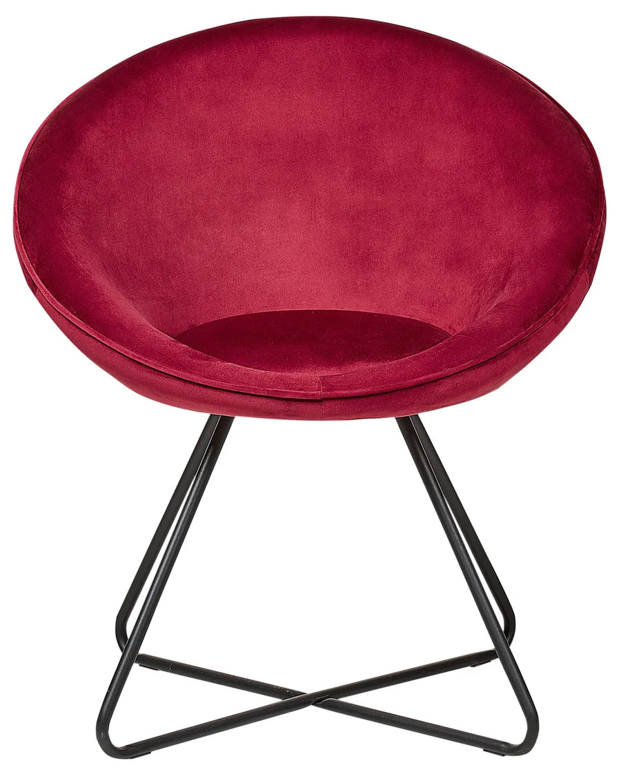 Round velvet accent chair in deep red with a curved bowl-shaped seat and black geometric metal legs.