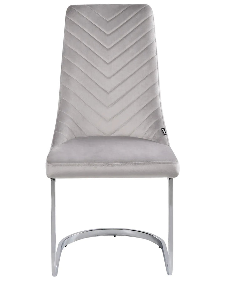 White upholstered dining chair with wooden legs.