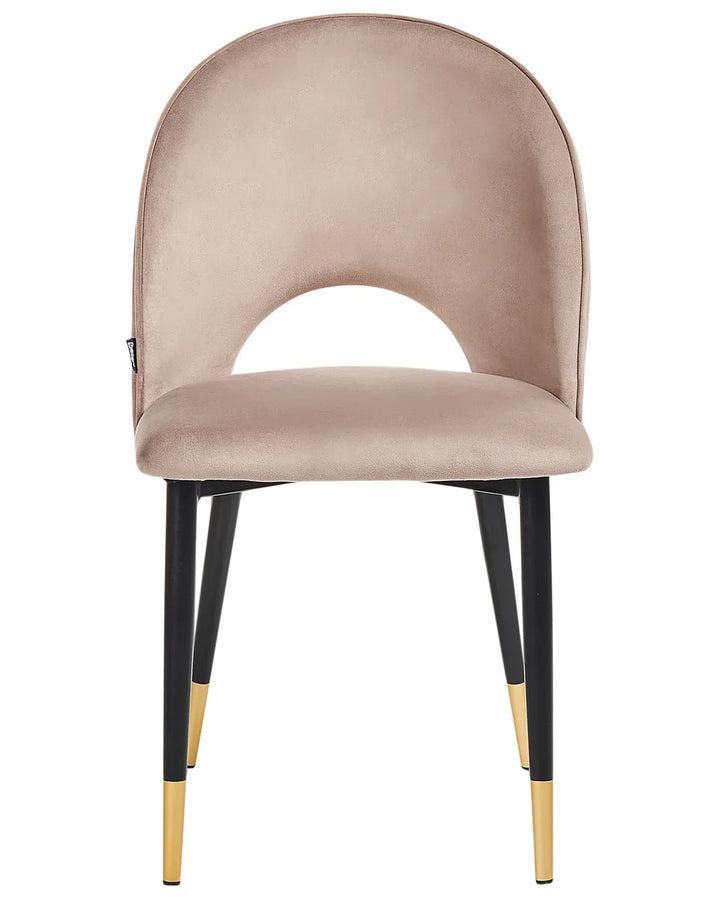 Taupe dining chair with a curved cut-out backrest and black legs finished with gold tips.