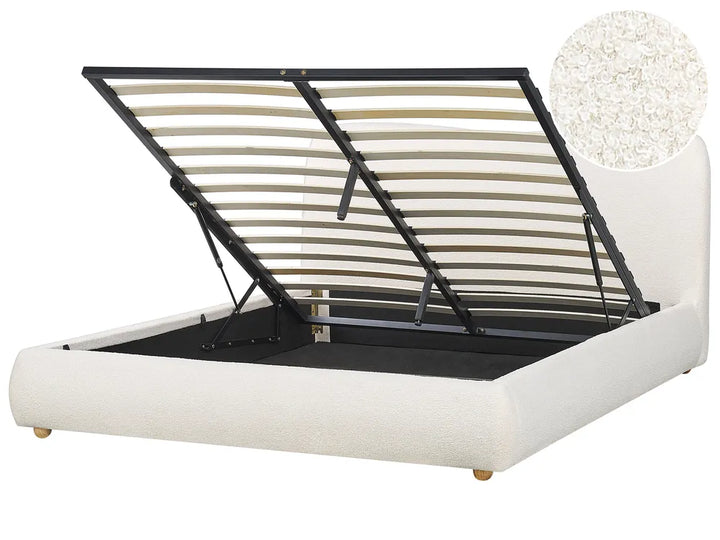 White bed frame with black metal slats on a white background
