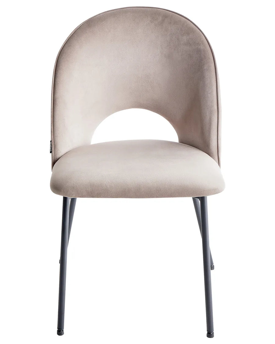Contemporary dining chair with soft taupe velvet upholstery, a distinctive curved backrest, and slim black metal legs for a refined modern look.
