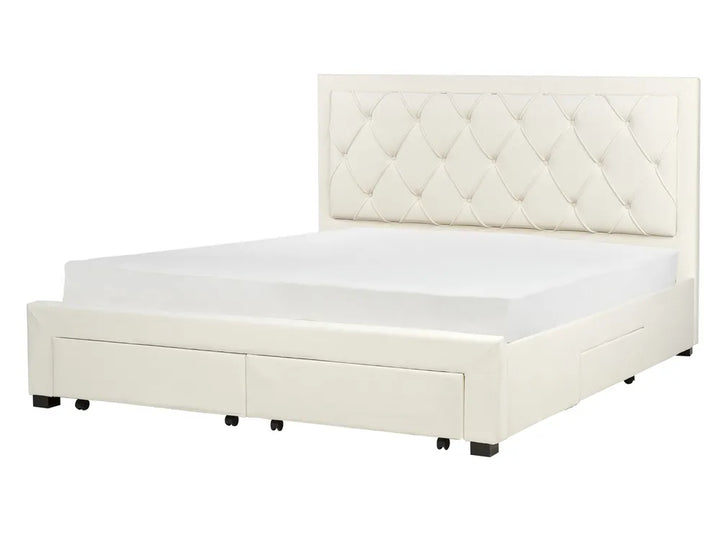 White upholstered bed with diamond patterned headboard 