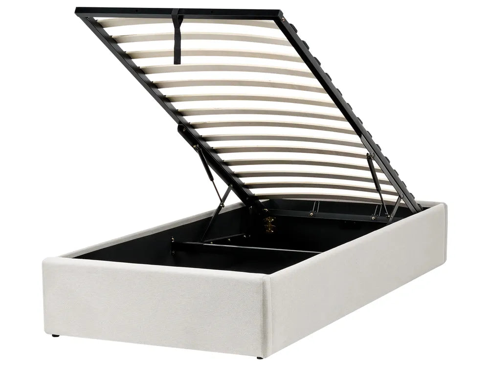 White bed frame with a black metal headboard 