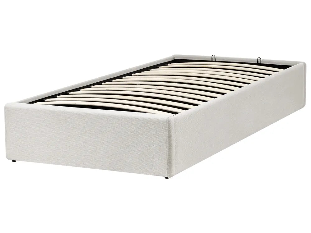White upholstered bed frame on a white background