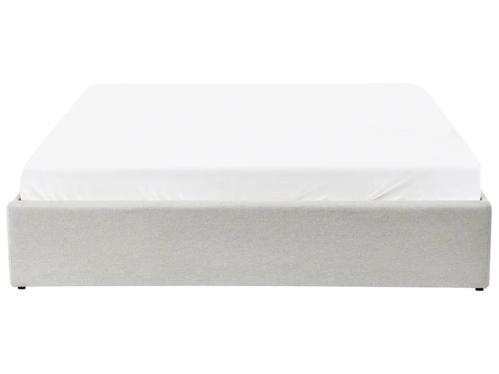 White bed frame with mattress on a white background