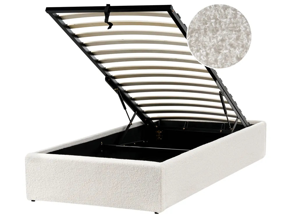 White upholstered bed frame with metal slat support on a white background