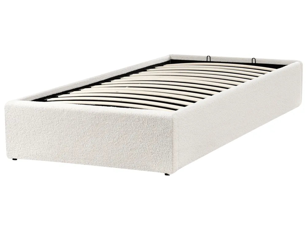 White upholstered bed frame on a white background