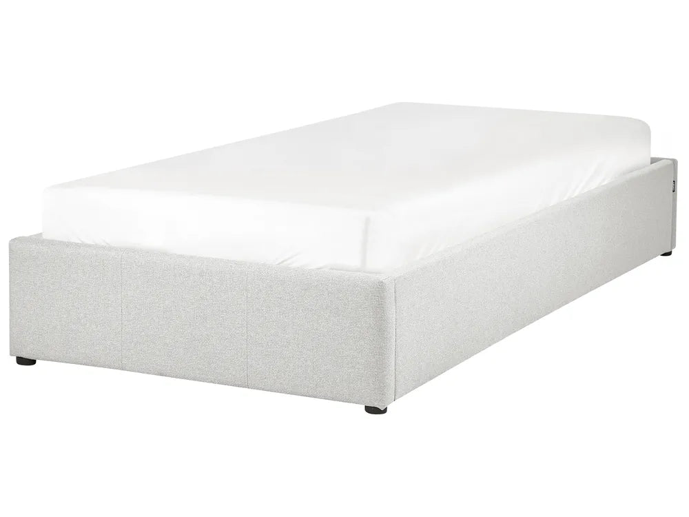 White bed frame with mattress on a white background