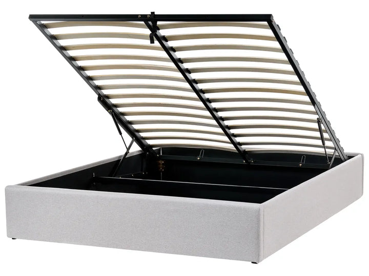 White bed frame with an open slatted headboard 