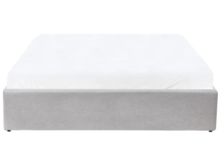 Grey upholstered bed frame with a white mattress 