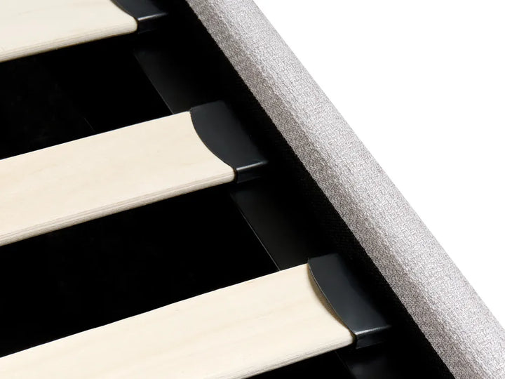 Close-up of a piano with black and white keys on a light gray background
