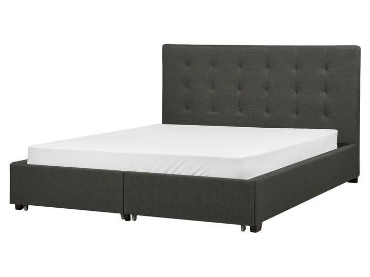 Black upholstered bed with white mattress 