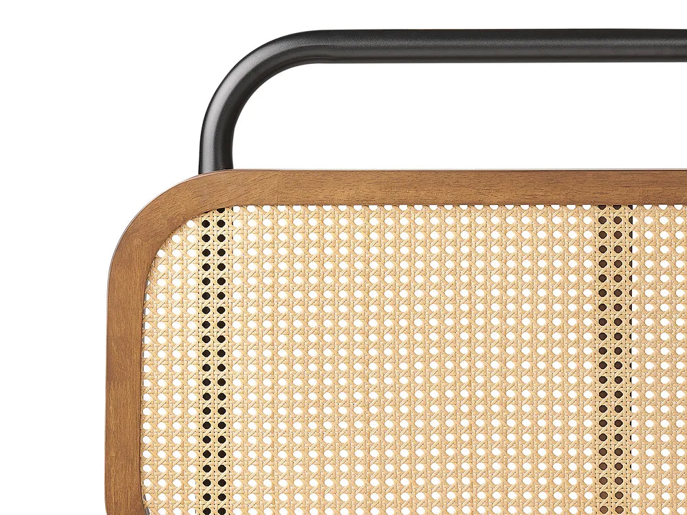Close-up of a chair with woven backrest and metal frame on a white background