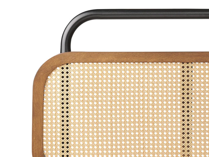 Close-up of a chair with woven backrest and metal frame on a white background