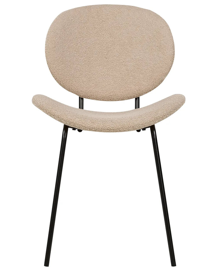 Modern accent dining chair upholstered in soft beige bouclé fabric, featuring a curved seat and rounded backrest supported by slim black metal legs.