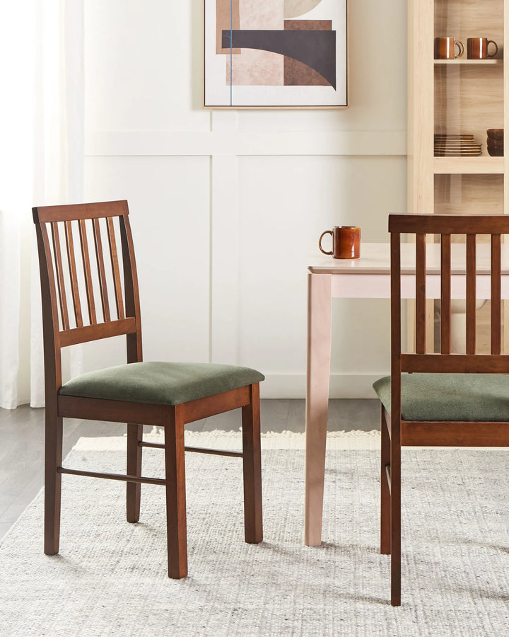 Rich wood dining chairs styled in a warm, inviting dining space with neutral décor and earthy tones, creating a cozy mid-century, rustic, and contemporary dining atmosphere.
